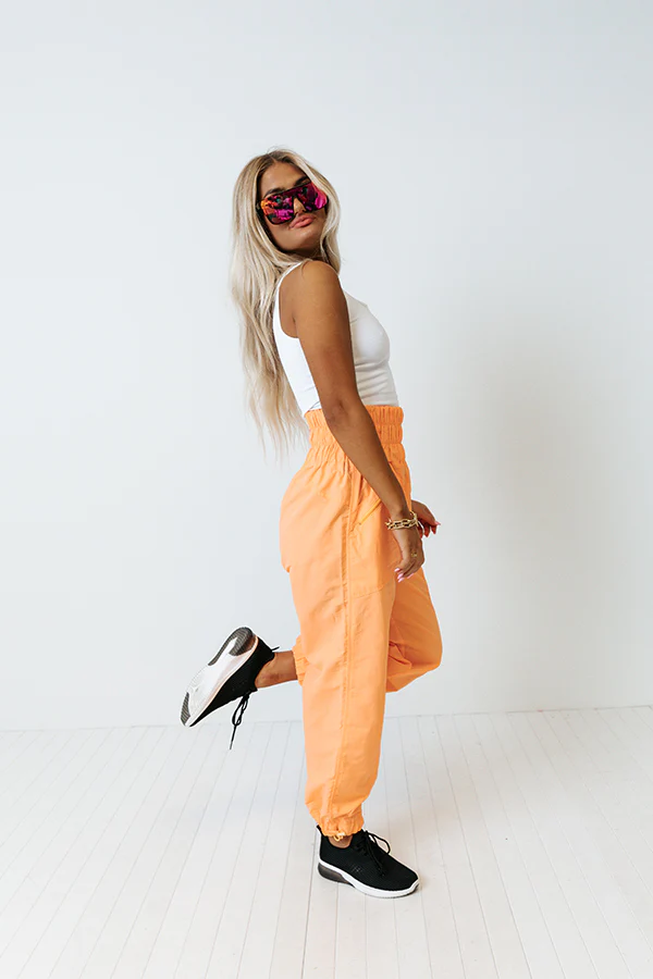 The Huxley High Waist Windbreaker Pants In Neon Orange - Image 3