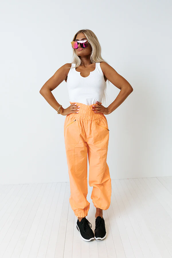 The Huxley High Waist Windbreaker Pants In Neon Orange - Image 4