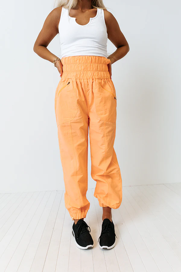 The Huxley High Waist Windbreaker Pants In Neon Orange - Image 5