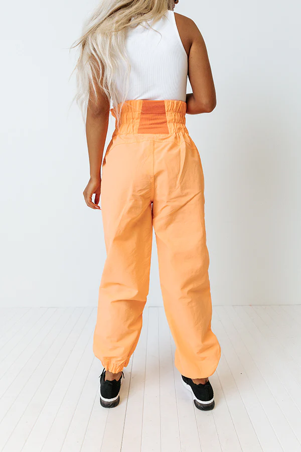 The Huxley High Waist Windbreaker Pants In Neon Orange - Image 6